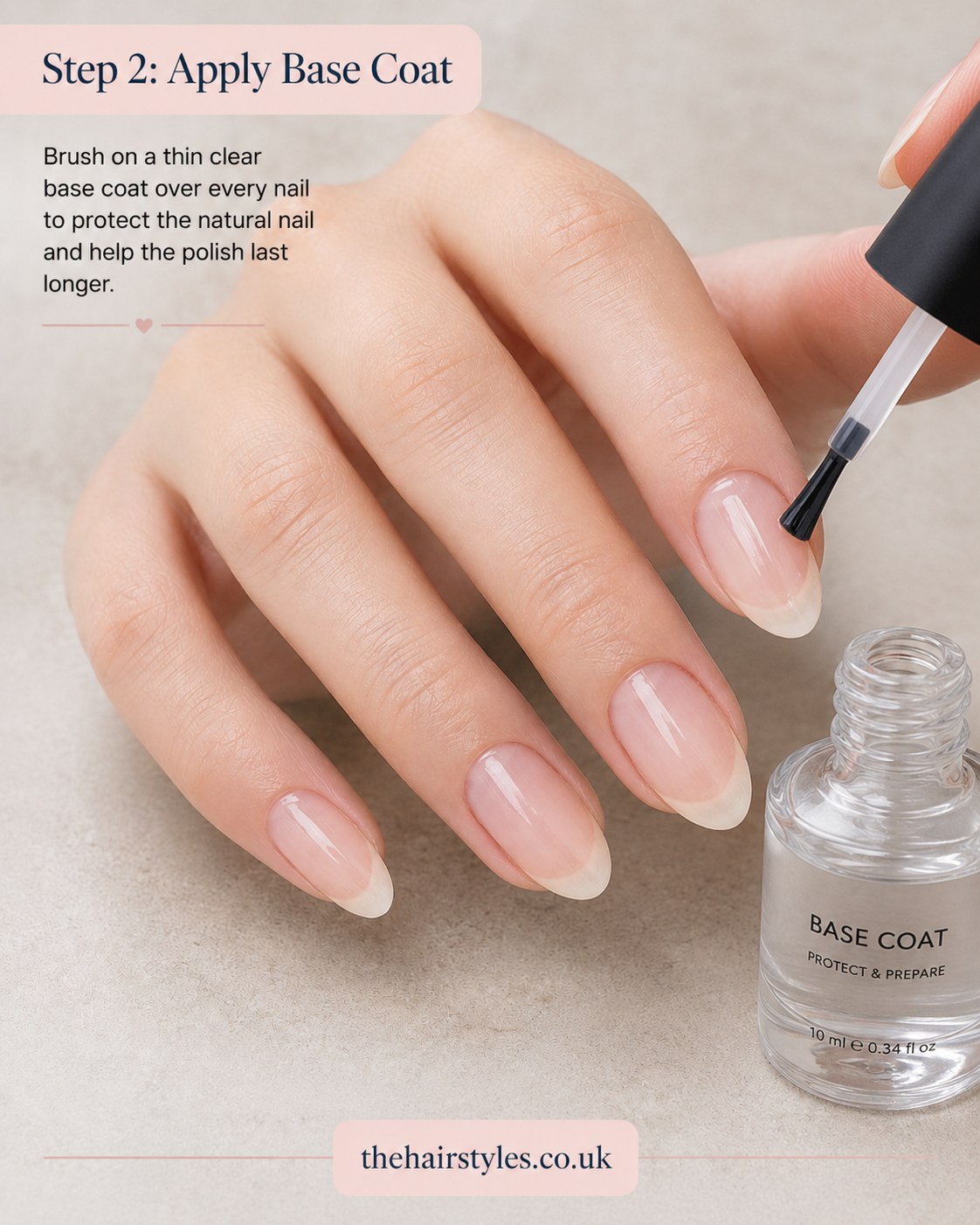 Brushing on a thin clear base coat before starting blueberry French tip nails