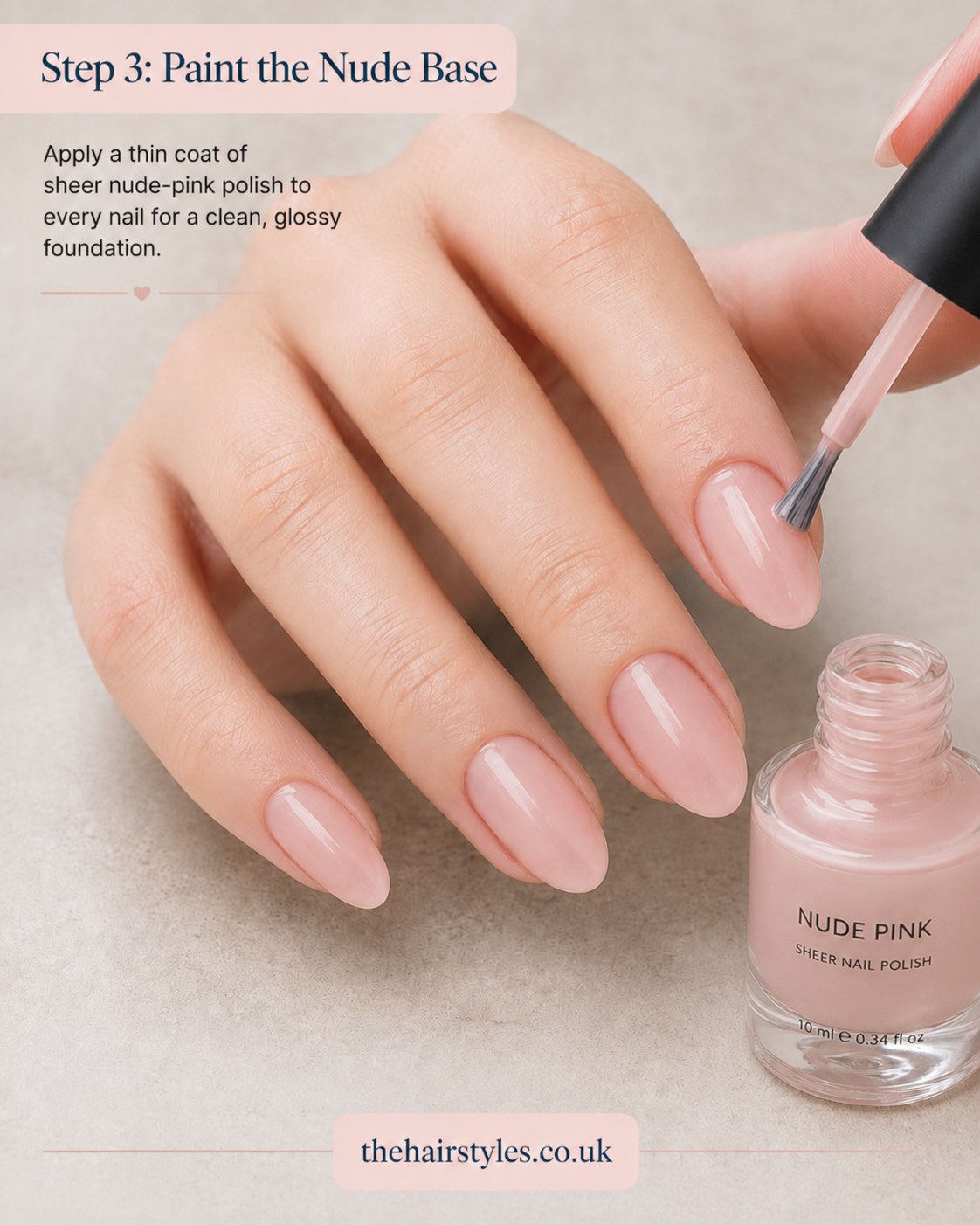 Painting a sheer nude-pink base coat as the foundation for blueberry French tip nails