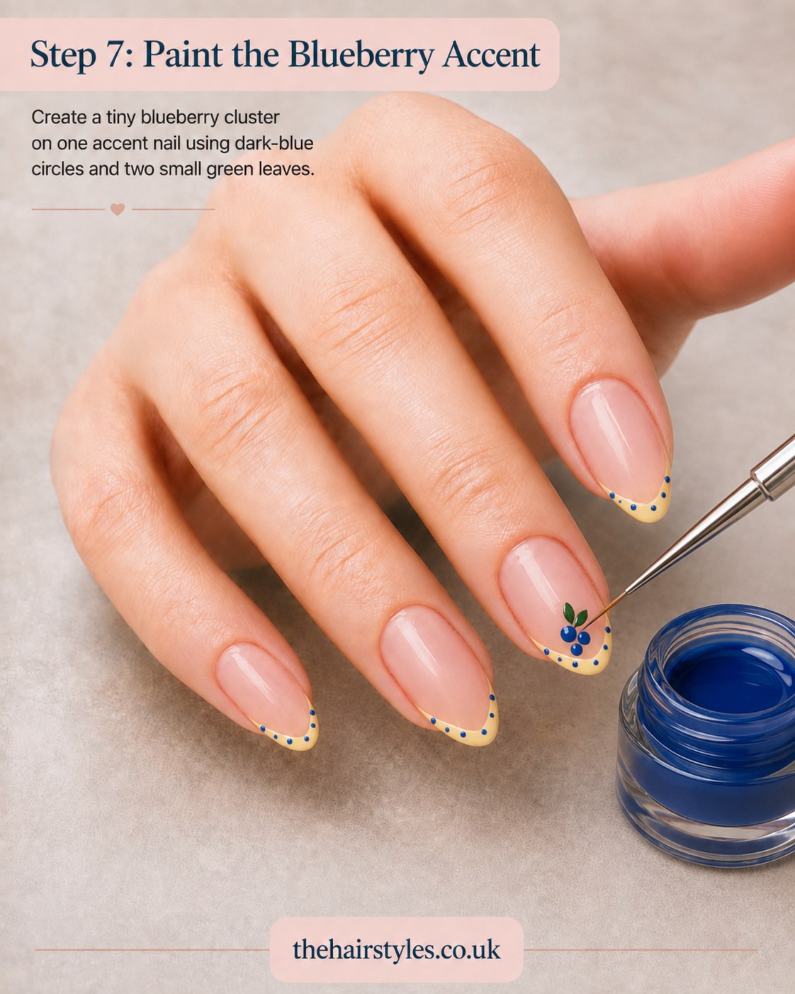 Hand-painting a small blueberry cluster with leaves on one accent nail