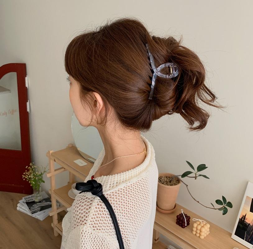 Woman with elegant claw clip hairstyle