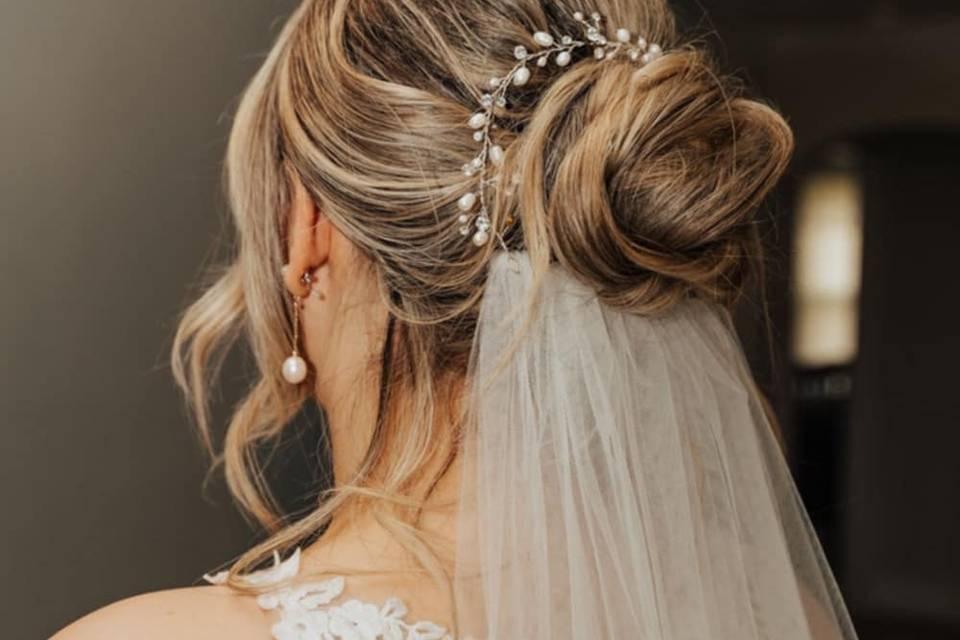 Elegant updo with bridal hair accessories