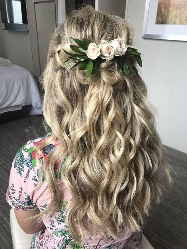 Half-up hairstyle with flower accessories