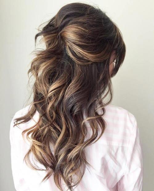 Half-up hairstyle with loose curls