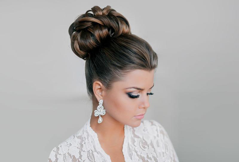 Glamorous bride wearing high bun updo