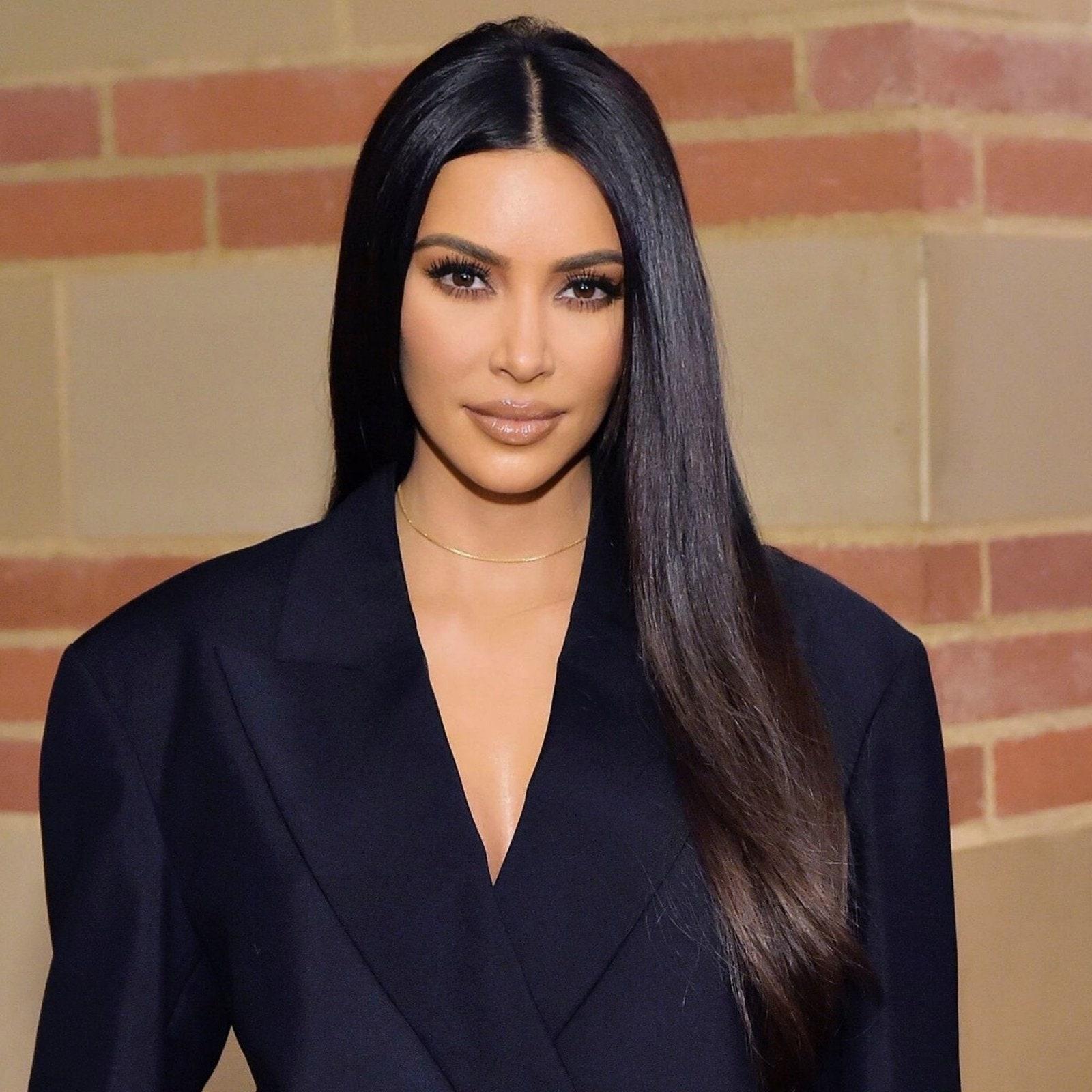 Kim Kardashian sleek straight centre part hair