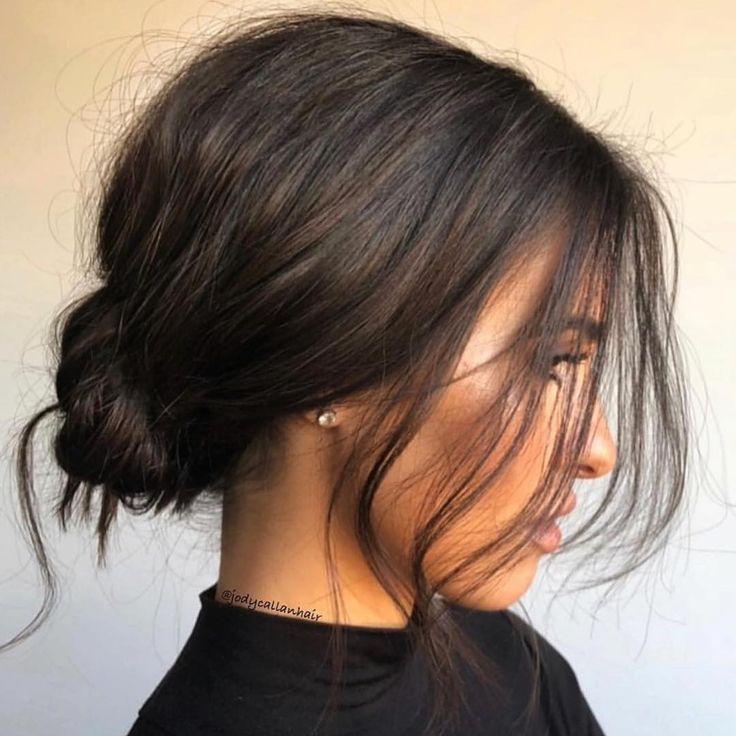 Low loose bun with soft strands