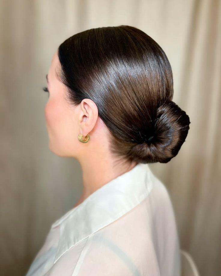Low sleek bun hairstyle from the back