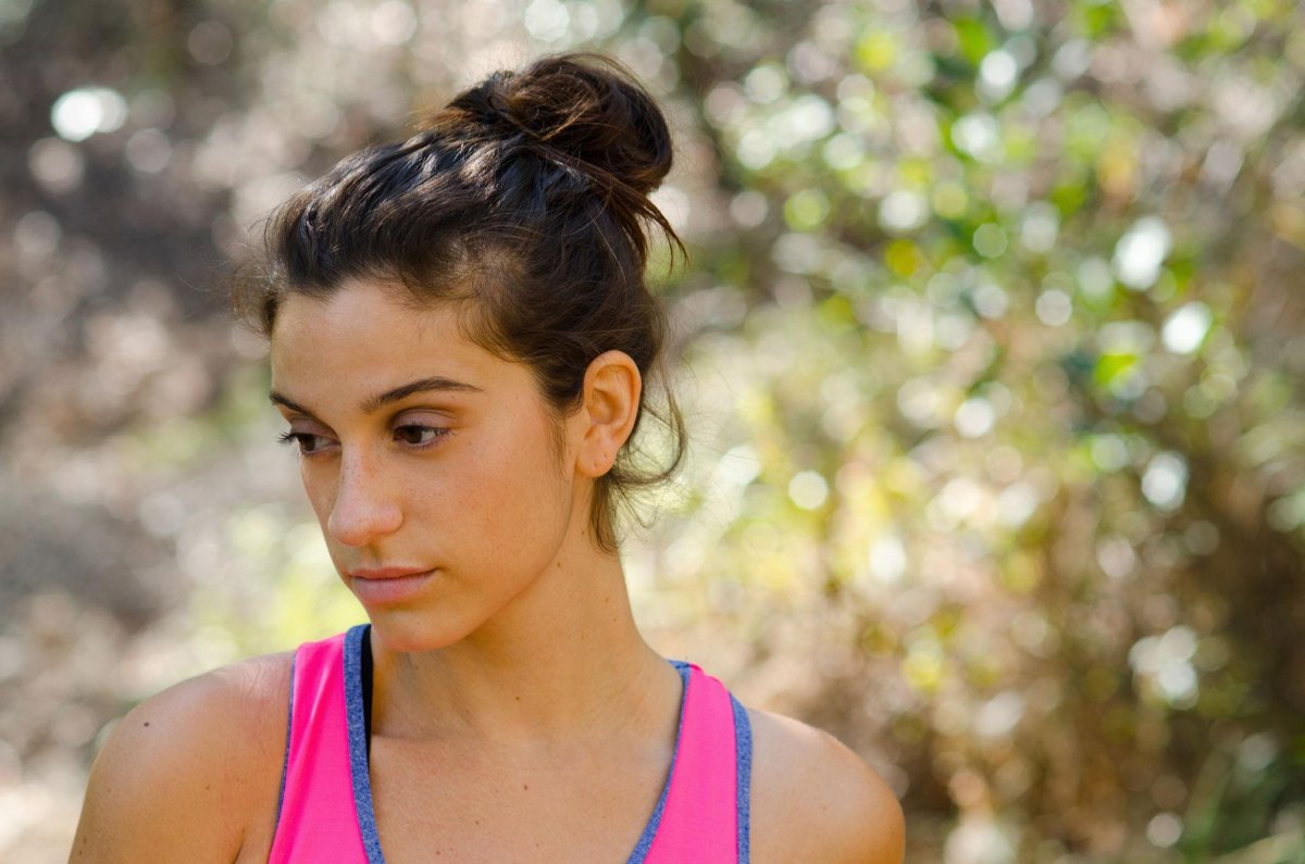 Woman with messy bun exercising