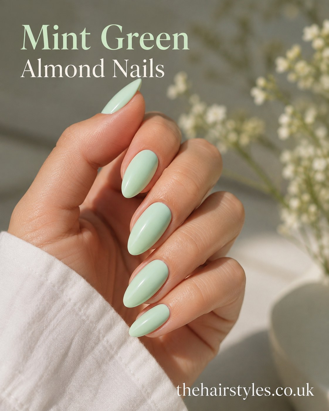 Solid mint green almond-shaped pastel nails finished with a smooth glossy gel top coat