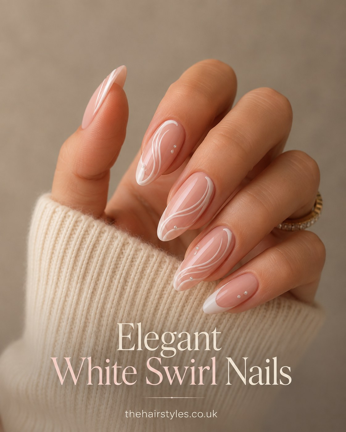 Nude base pastel nails with fine hand-painted white swirl line art on almond-shaped tips