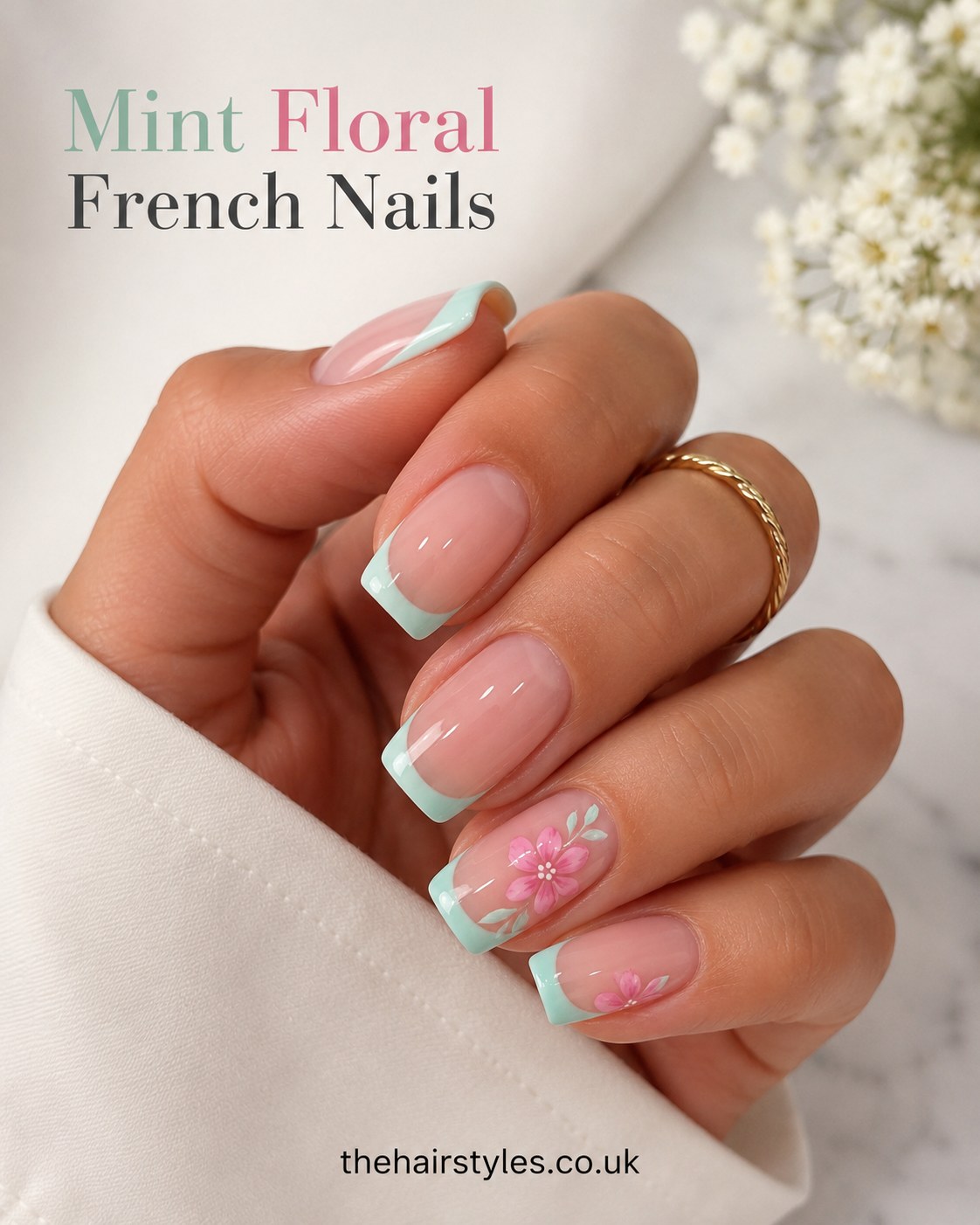 Mint floral French nails with pastel mint tips and a hand-painted pink flower on the accent nail