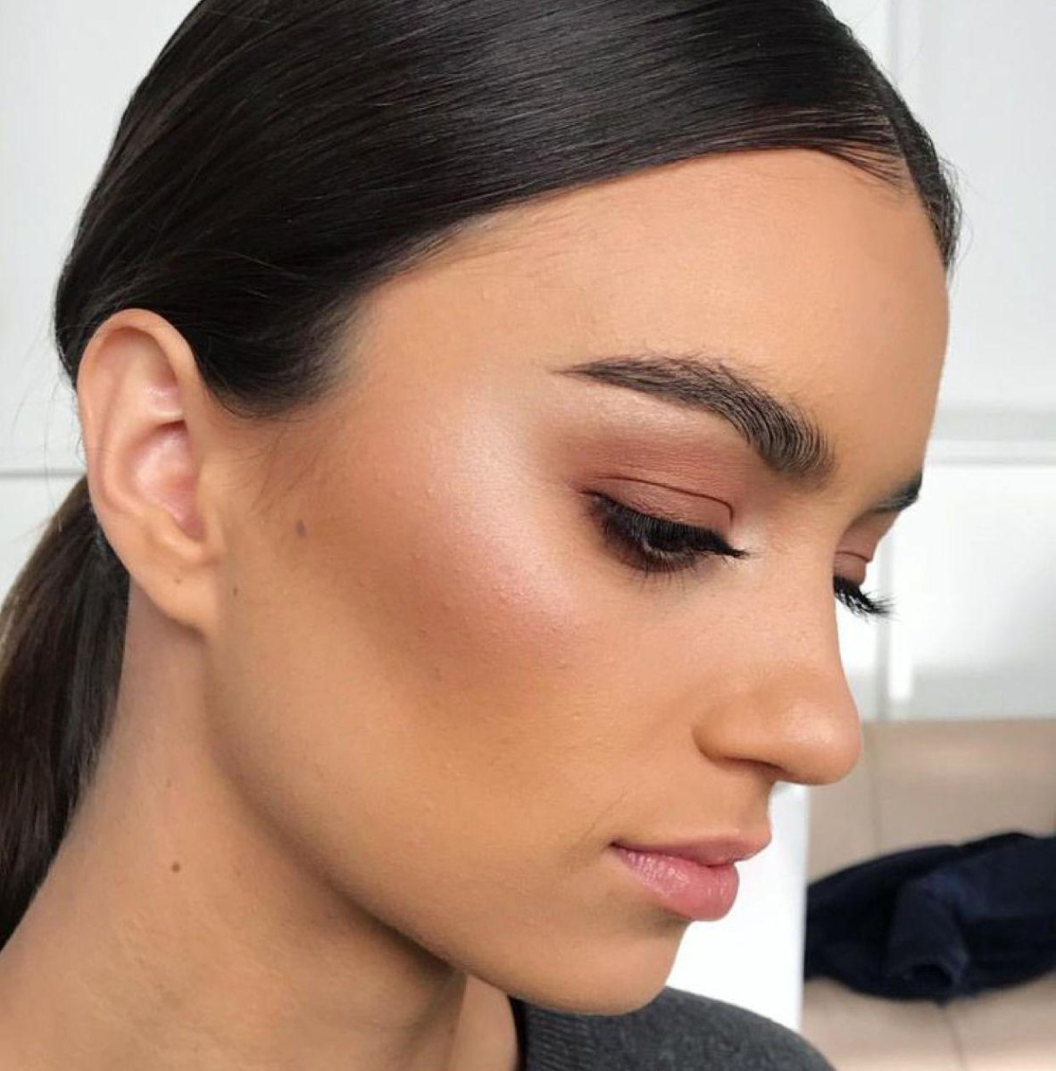 Warm bronzer sculpted cheekbones makeup