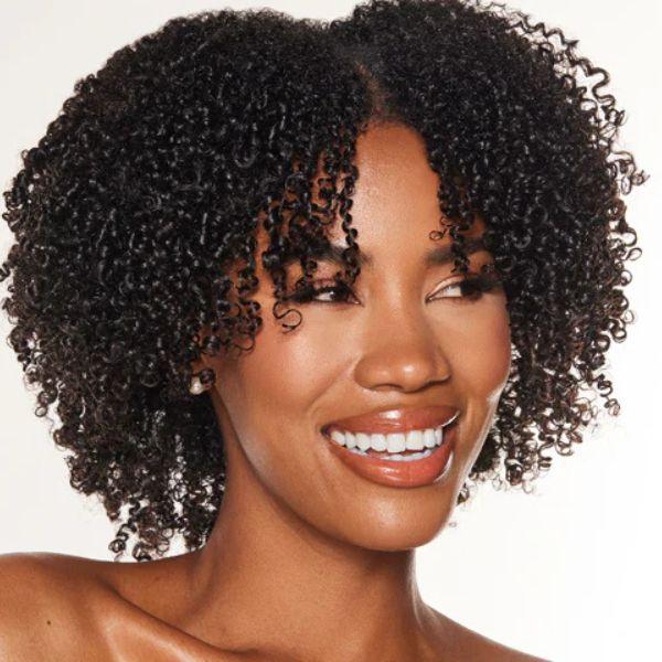 Woman with natural wash and go hairstyle