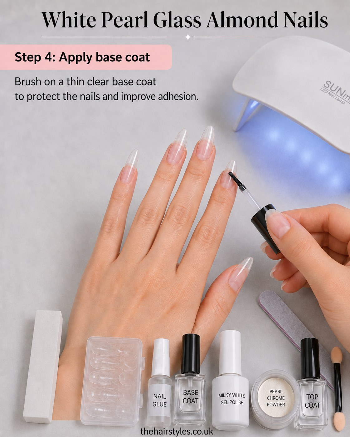 Brushing on a thin clear base coat over almond tips before the white pearl glass almond nails colour