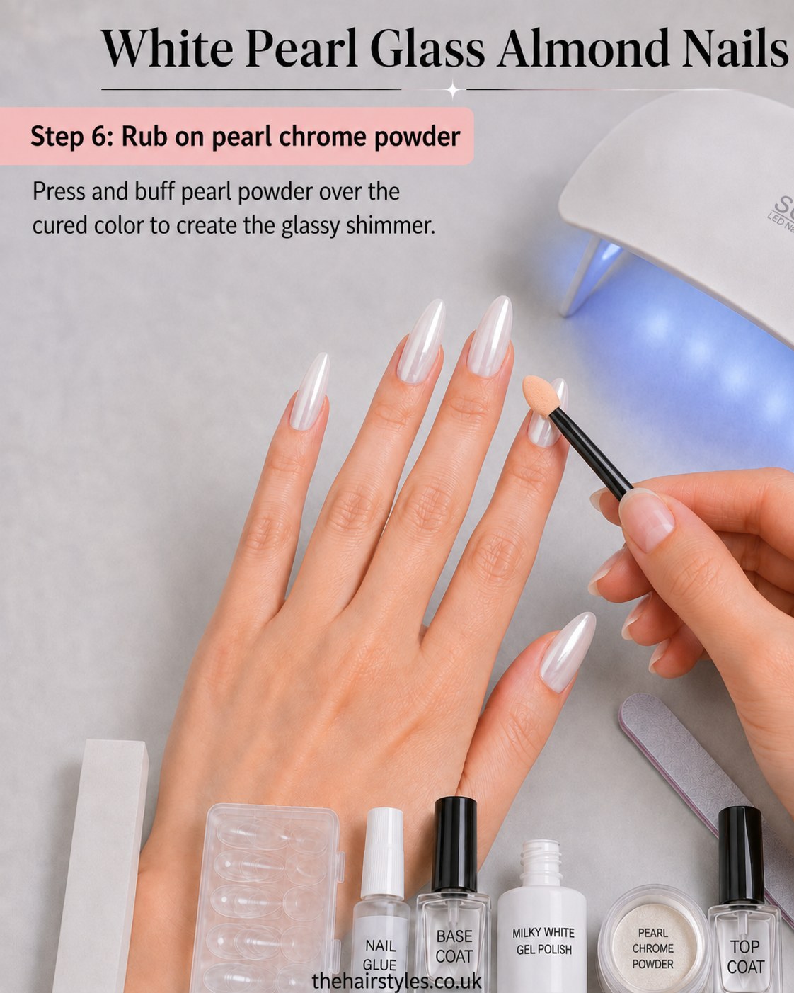 Pressing pearl chrome powder onto cured gel to create the shimmer in white pearl glass almond nails