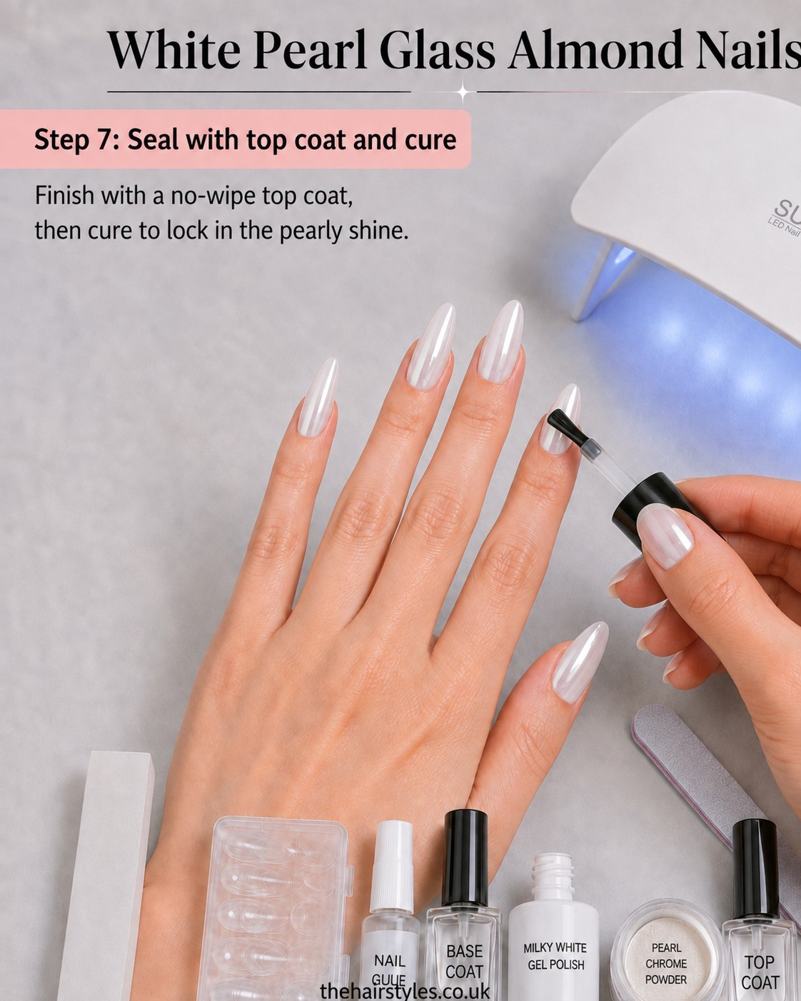 Sealing white pearl glass almond nails with a no-wipe top coat under a UV lamp