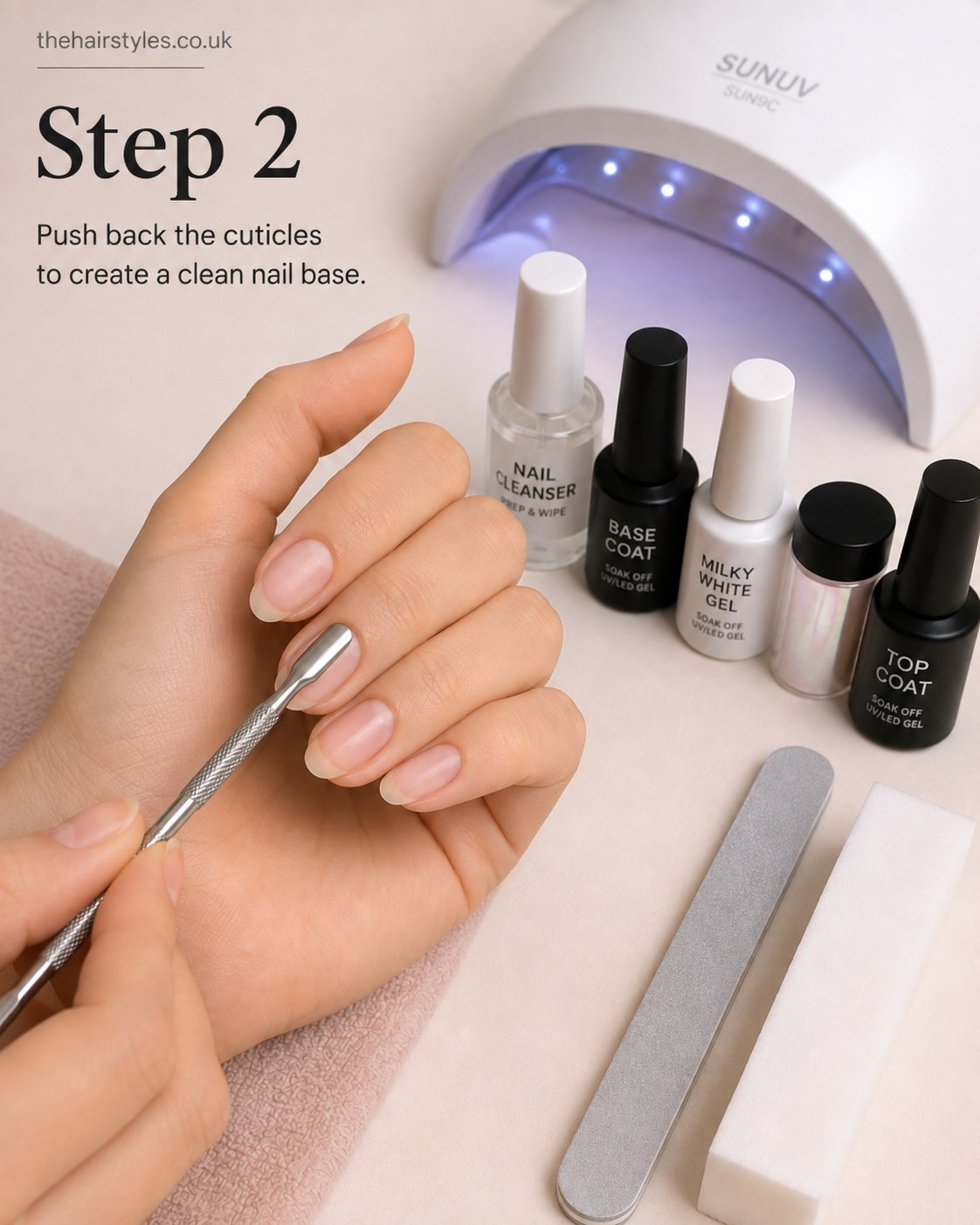 Pushing back cuticles to prep a clean base for white pearl glass nails oval look