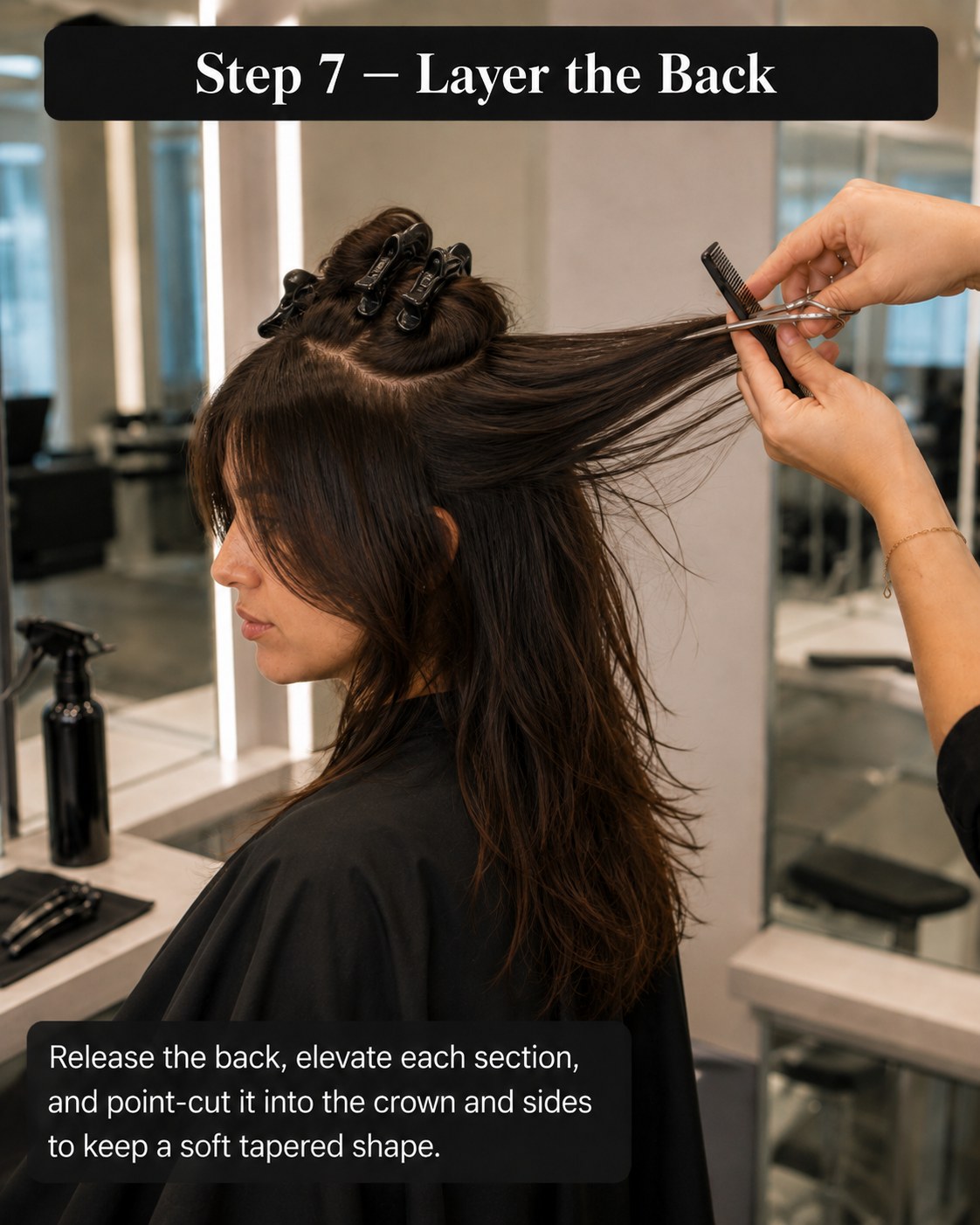 Elevating the back sections to point-cut a tapered, layered wolf cut shape.
